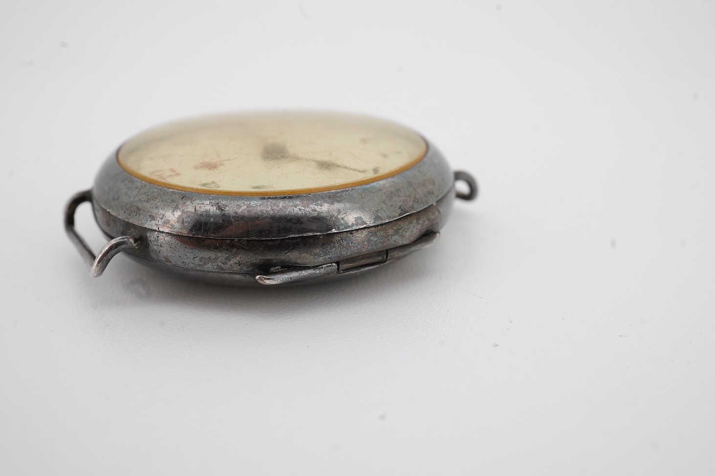 A lady's early 20th century silver nurse's or medic's manual wind wrist watch, with Red Cross symbol on the dial, engraved inscription on the back, 'Will to Mabel, 1916', case import marked for London, 1914, no strap.